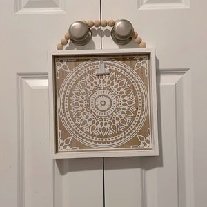 White boho hanging picture holder.